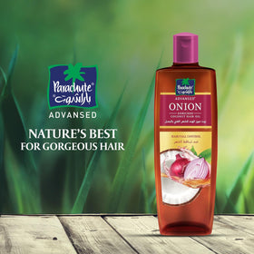 Parachute Advansed oil applied to scalp demonstrating targeted nourishment