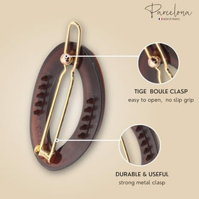 Parcelona clips beside ruler showing 1.25 inch size for scale