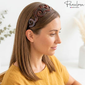 Parcelona headband next to ruler showing 1.5 inch width and scale benefit