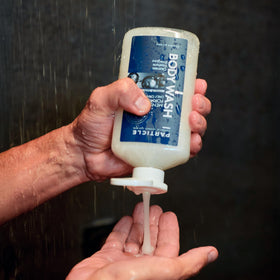 Particle in-shower scene showing refreshing cleanse after workout benefit