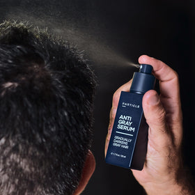 Particle bottle in hand to show size, conveying portability and daily use ease