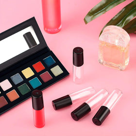 Patelai tube held in hand to illustrate compact 1.2 ml size and portability