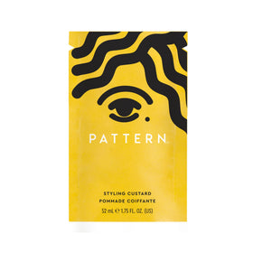 PATTERN lifestyle model with defined curls illustrating real-world styling results