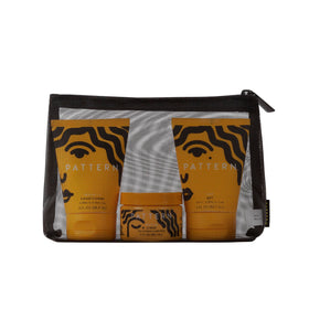 PATTERN mesh cosmetic bag open with kit visible for travel convenience