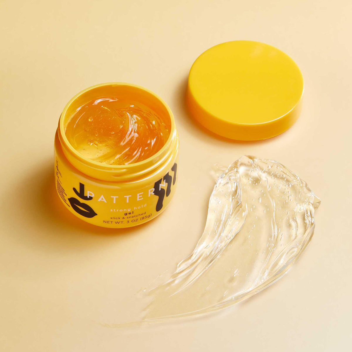 PATTERN jar next to passport illustrating travel-size convenience benefit