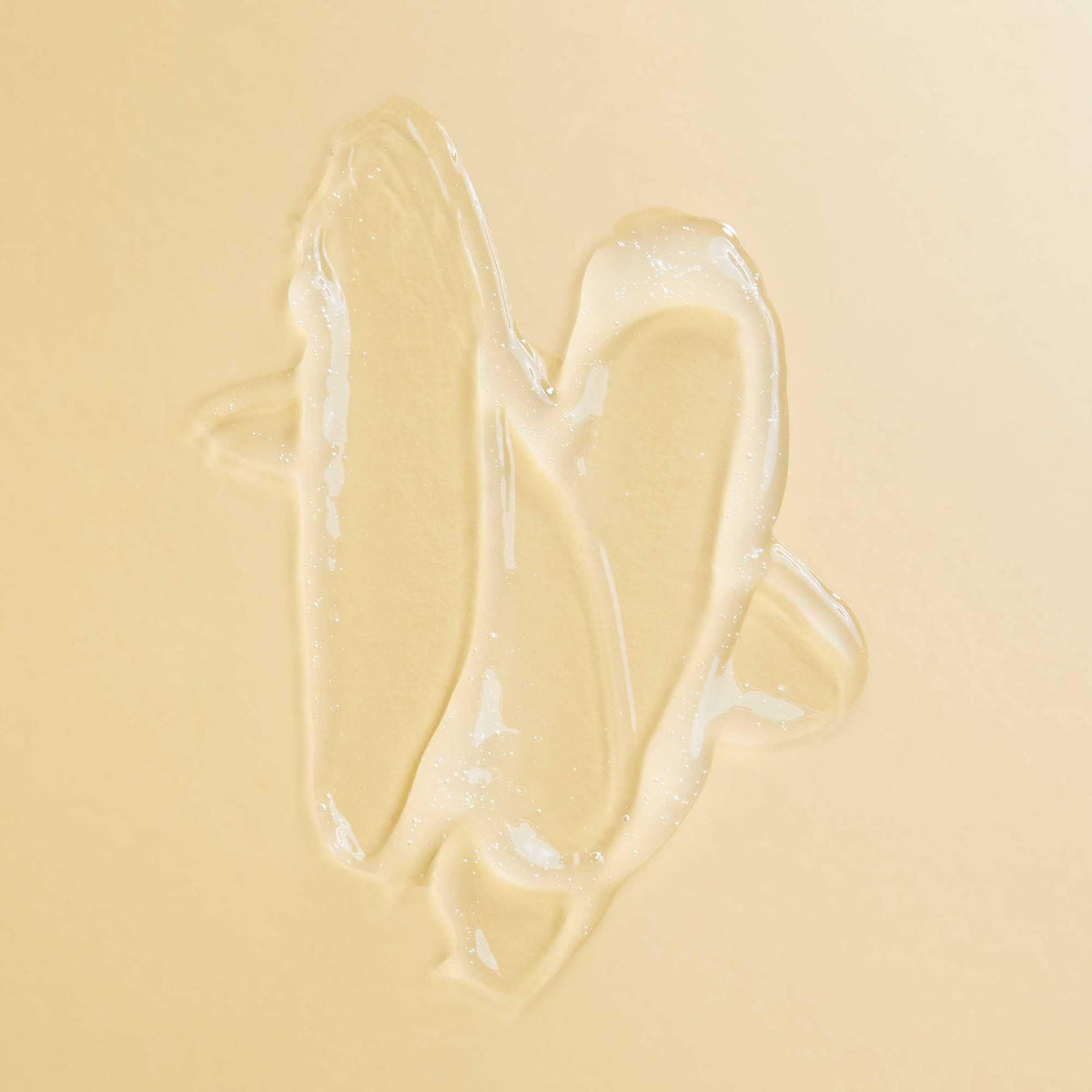 PATTERN scalp serum single drop on fingertip showing lightweight texture and quick absorption benefit