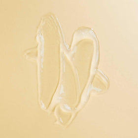 PATTERN scalp serum single drop on fingertip showing lightweight texture and quick absorption benefit