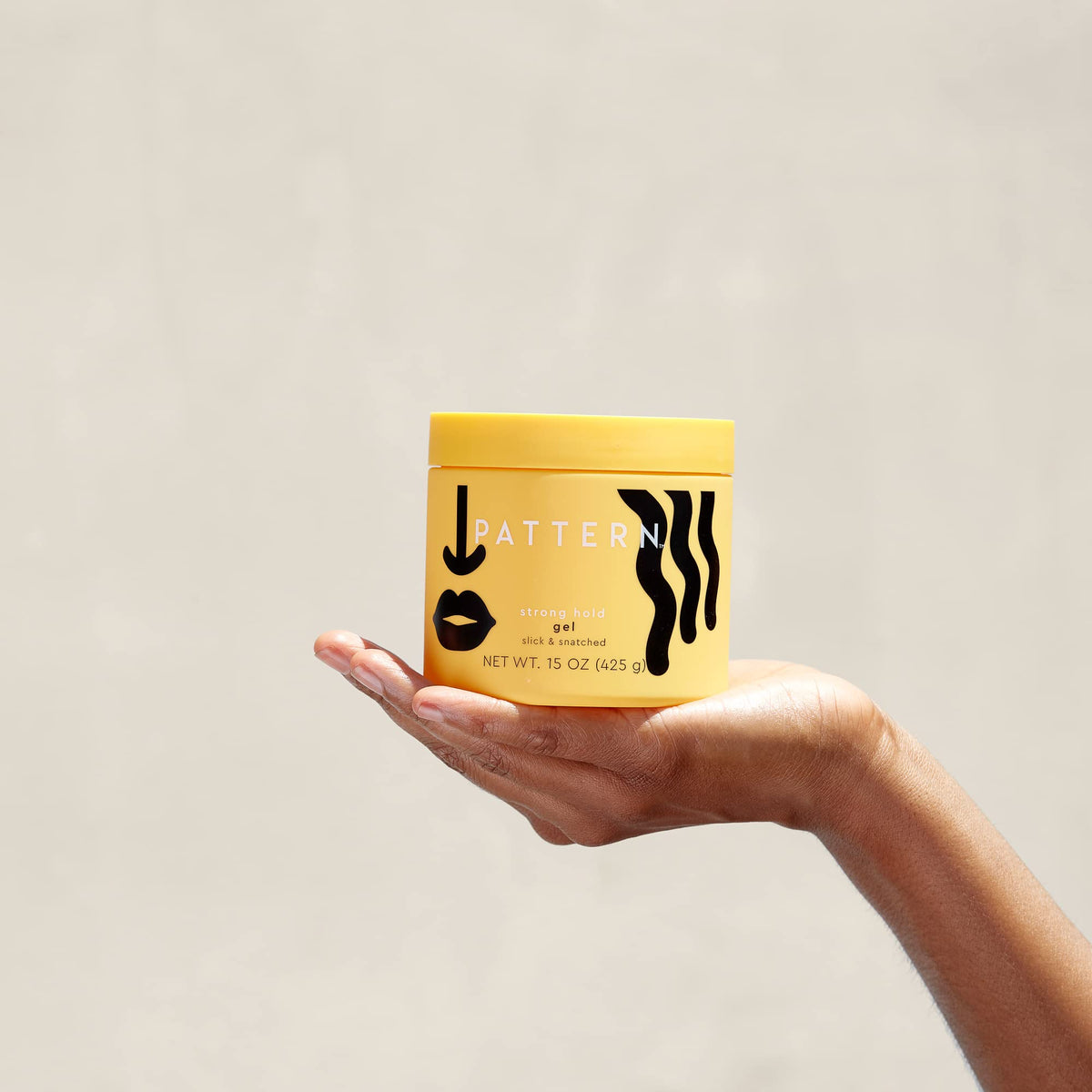 PATTERN applying gel to curls to define and hold style