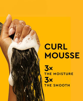 PATTERN styled wash-and-go on model showing defined, moisturized curls in lifestyle setting