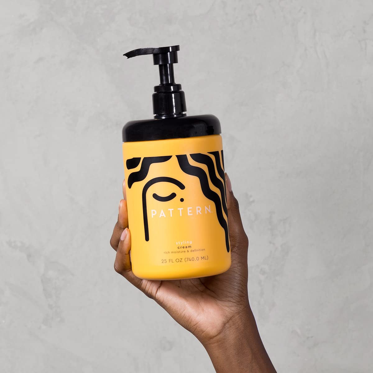 PATTERN styling cream applied to curly hair demonstrating defined, frizz-free results