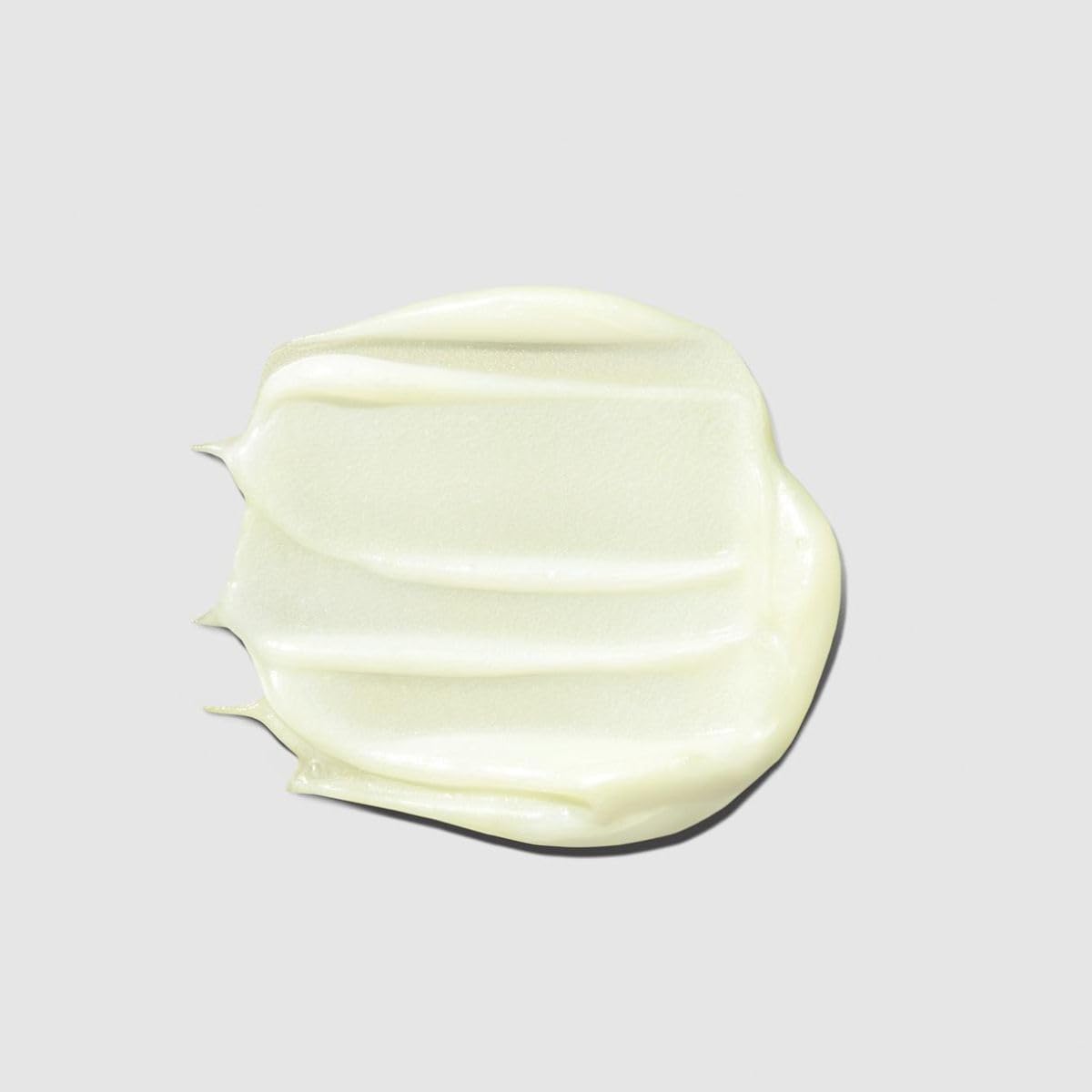 Paul Mitchell conditioner being applied in shower for smoother hair