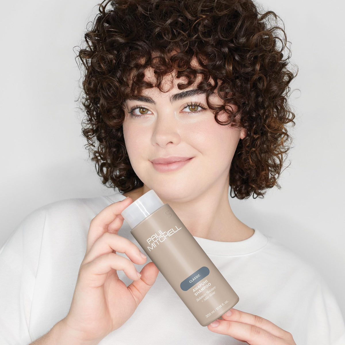 paul mitchell shampoo pouring into palm showing easy-dispense benefit