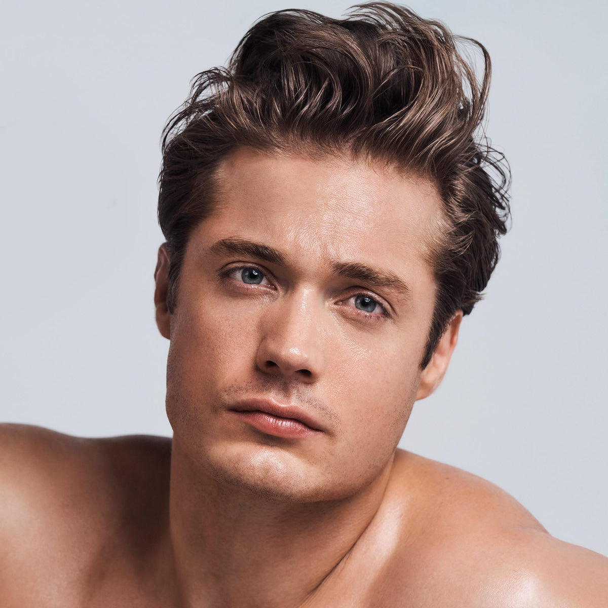 Paul Mitchell clear essential next to hairbrush illustrating suitability for all hair types