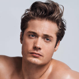 Paul Mitchell clear essential next to hairbrush illustrating suitability for all hair types
