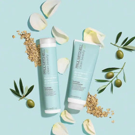 Paul Mitchell hydrate conditioner 33.8 fl oz next to a hand for scale and value