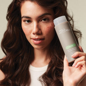 Paul Mitchell conditioner staged in bathroom setting to show daily routine use and fresh fragrance benefit