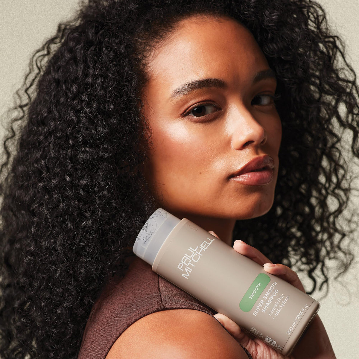 Paul Mitchell bottle placed on bathroom shelf showing lifestyle ease and daily use benefit