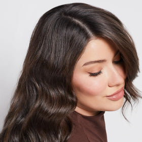 Paul Mitchell shampoo lather on wet hair illustrating gentle cleansing