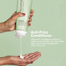 Paul Mitchell conditioner texture close-up showing creamy emollients for softening
