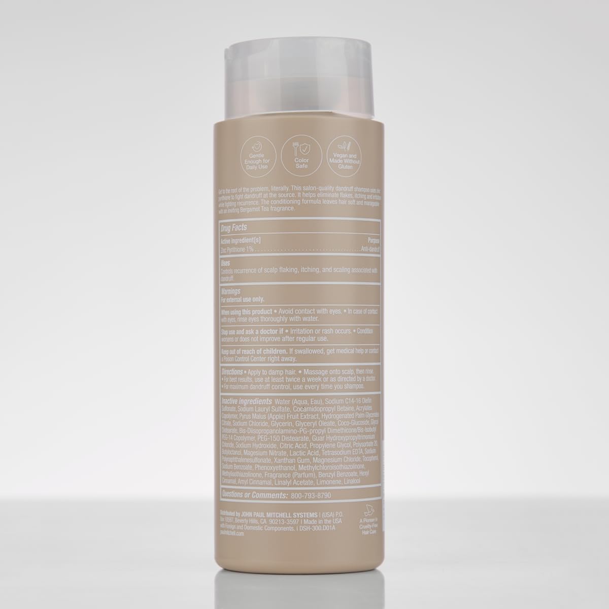 Paul Mitchell shampoo on bathroom shelf in a calming setting