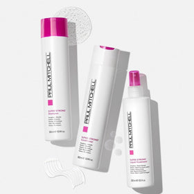 Paul Mitchell shampoo being applied to wet hair for strengthening and smoothing benefit