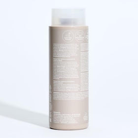 Paul Mitchell shampoo staged in bathroom for fresh lemon-scented wash benefit