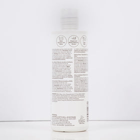 Paul Mitchell on bathroom vanity lifestyle shot promoting salon-quality