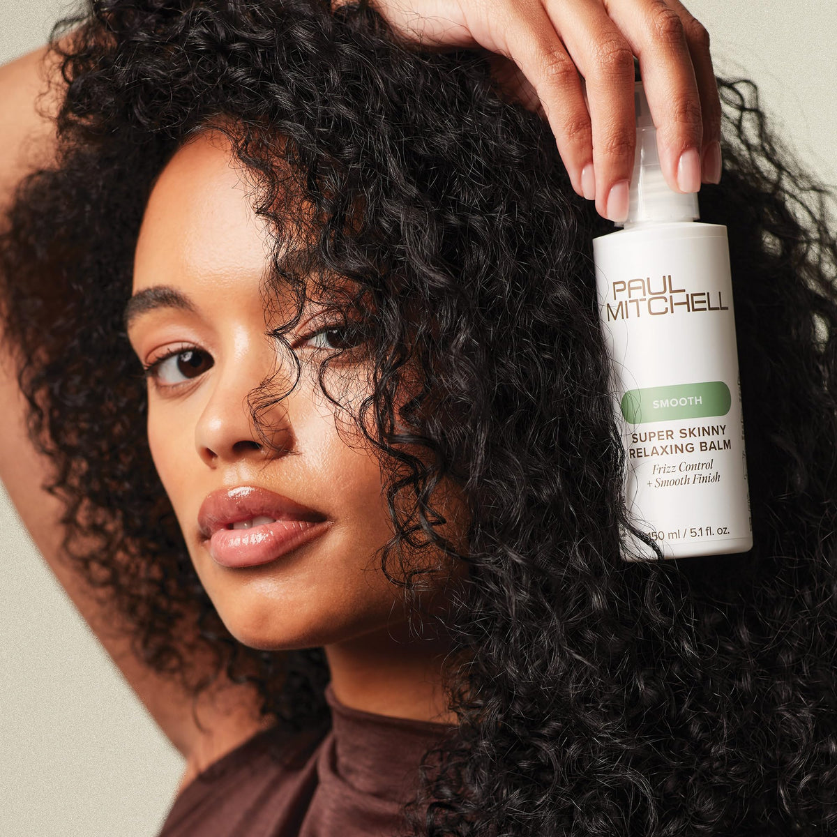 Paul Mitchell applied to damp hair illustrating smoother, easier blow-drying