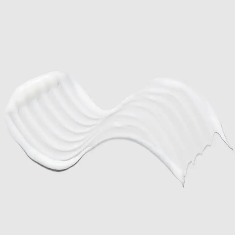 Paul Mitchell Super Strong conditioner creamy texture on palm for easy detangling benefit