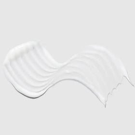 Paul Mitchell Super Strong conditioner texture closeup highlighting creamy slip and moisturizing benefit