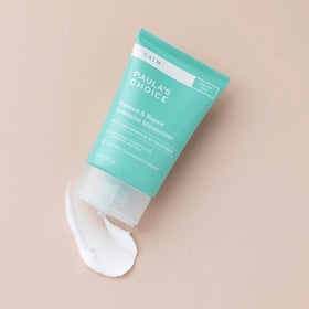 Paula's Choice product beside a ruler showing 2 oz size and portability