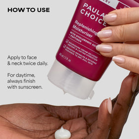 Paula's Choice moisturizer in hand to show compact 2 oz size and travel-friendly convenience
