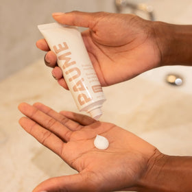 PAUME hand balm inside a bag illustrating portability and on-the-go moisturization