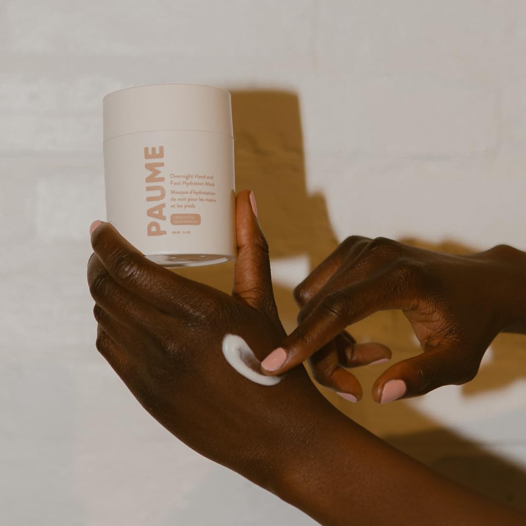 PAUME tub next to hand for scale indicating compact travel-ready size
