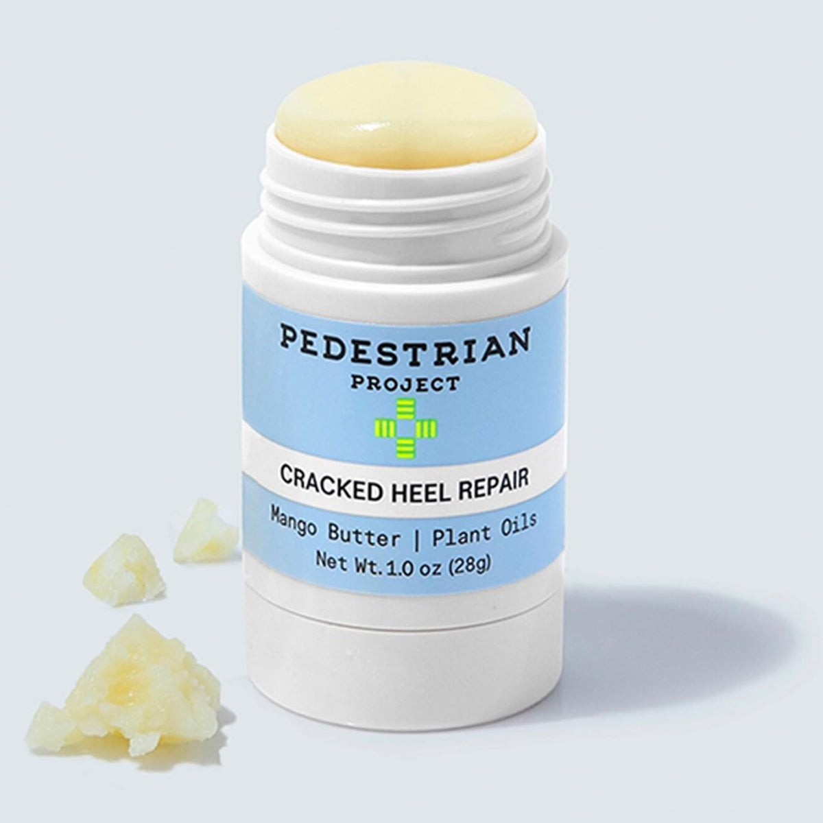 Pedestrian Project balm applied to heel illustrating spot treatment and smoother skin