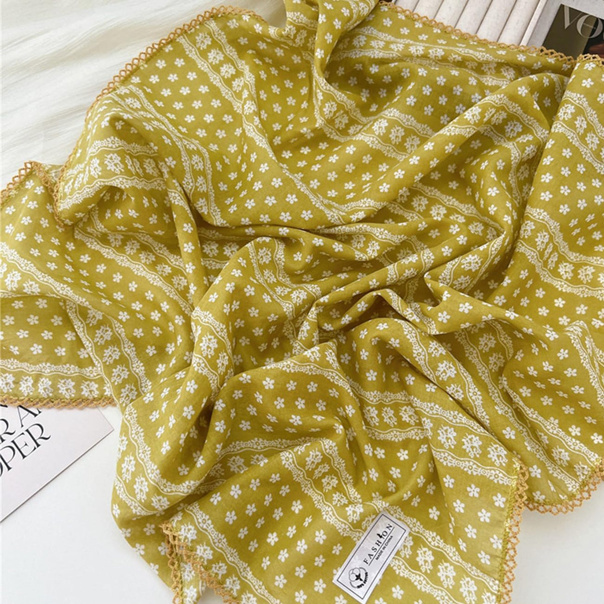 Pemilosci bandana knotted on handbag illustrating accessory use and added flair