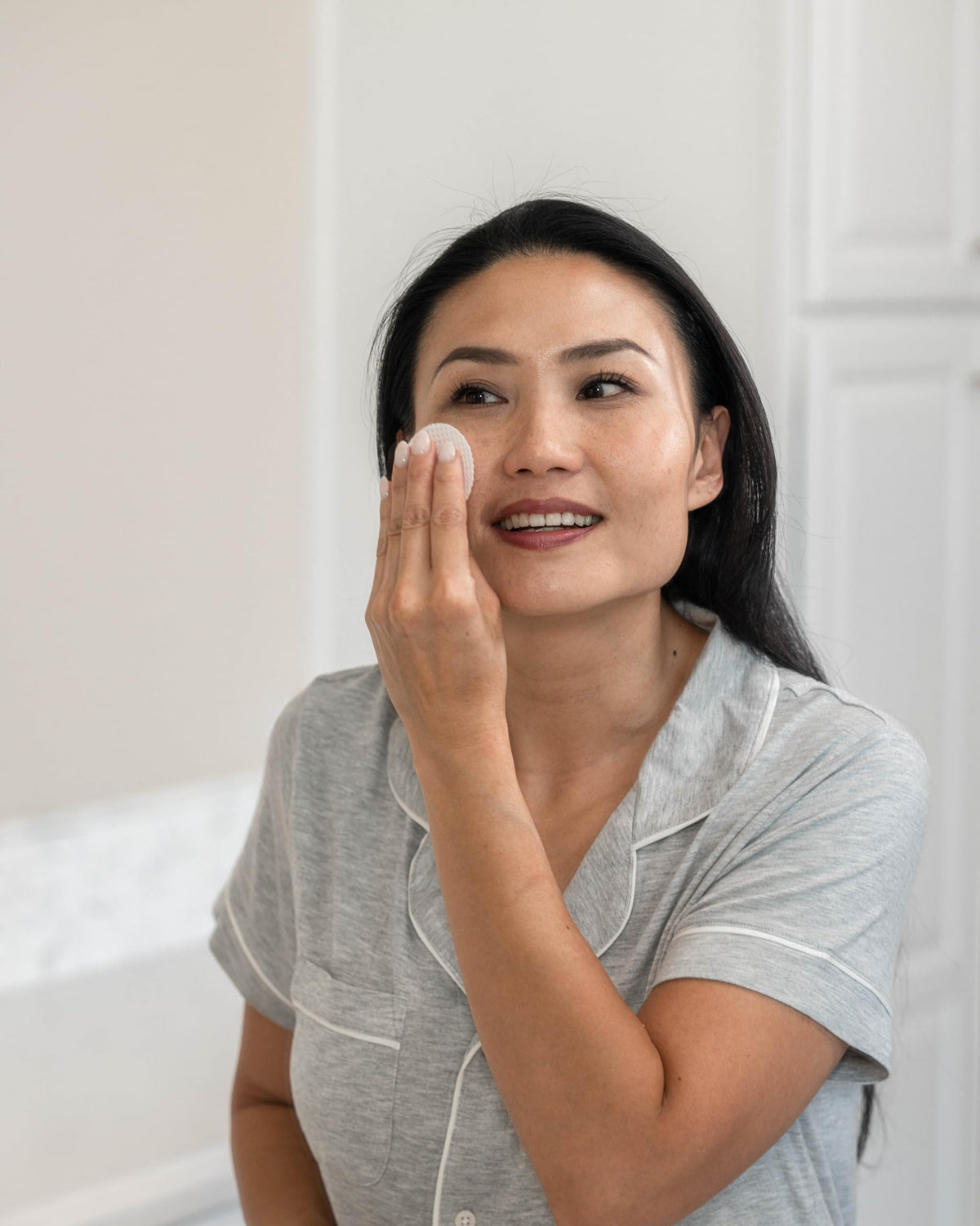 Perfect Image pads on bathroom counter with skincare for tidy professional feel