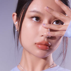 Peripera on model in daytime makeup showing natural plumping glow benefit