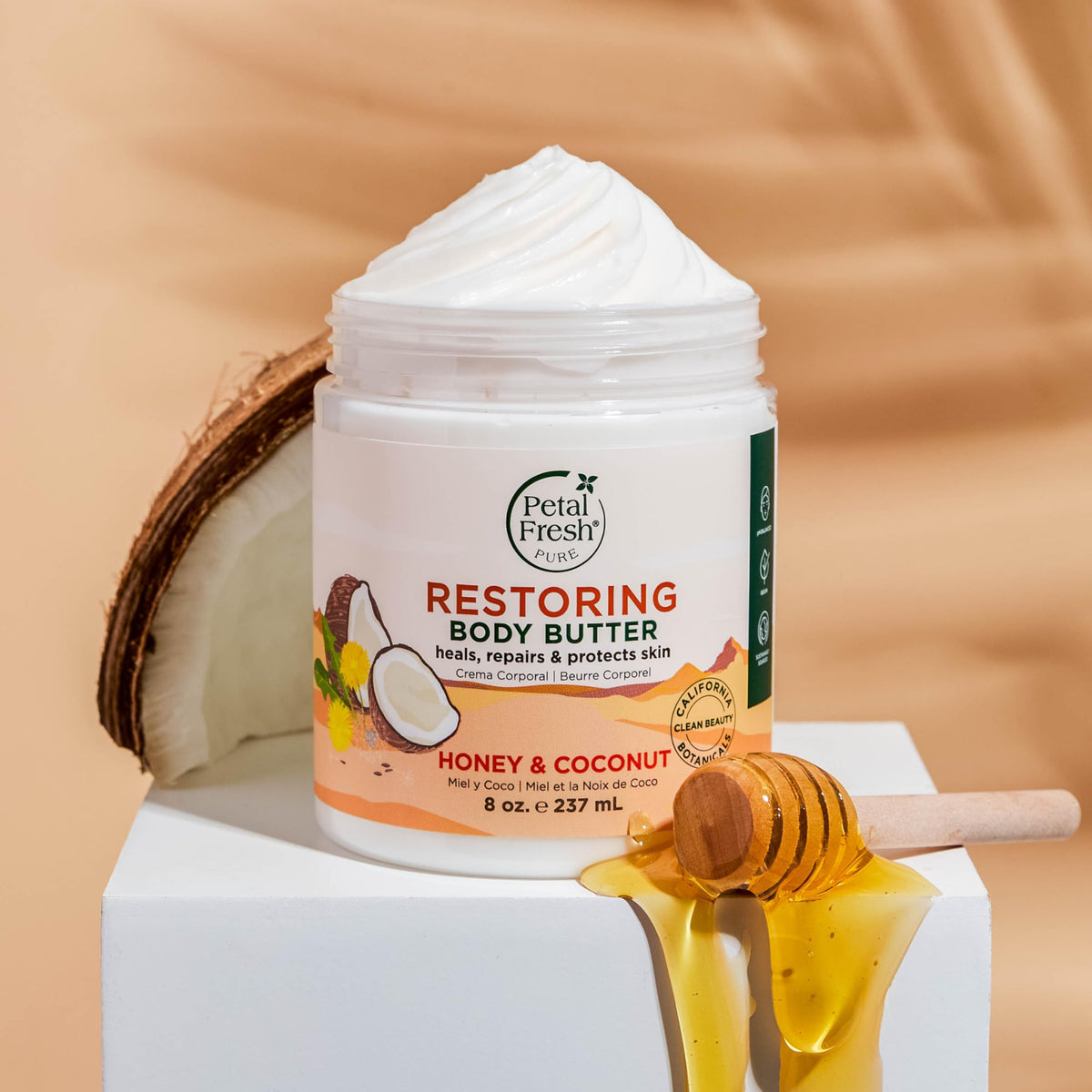 Petal Fresh honey ingredient spoon beside jar highlighting natural humectant benefit