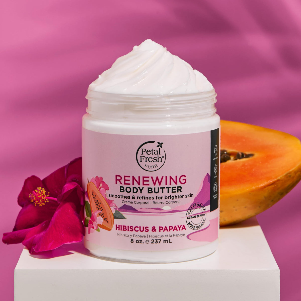 Petal Fresh ingredients display with hibiscus and papaya highlighting renewal benefit