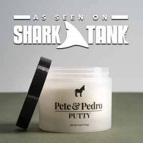 Bathroom shelf with Pete & Pedro putty among grooming products showing daily use