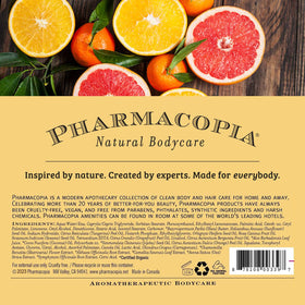 pharmacopia shampoo styled on bathroom counter with towel benefit: uplifting everyday ritual
