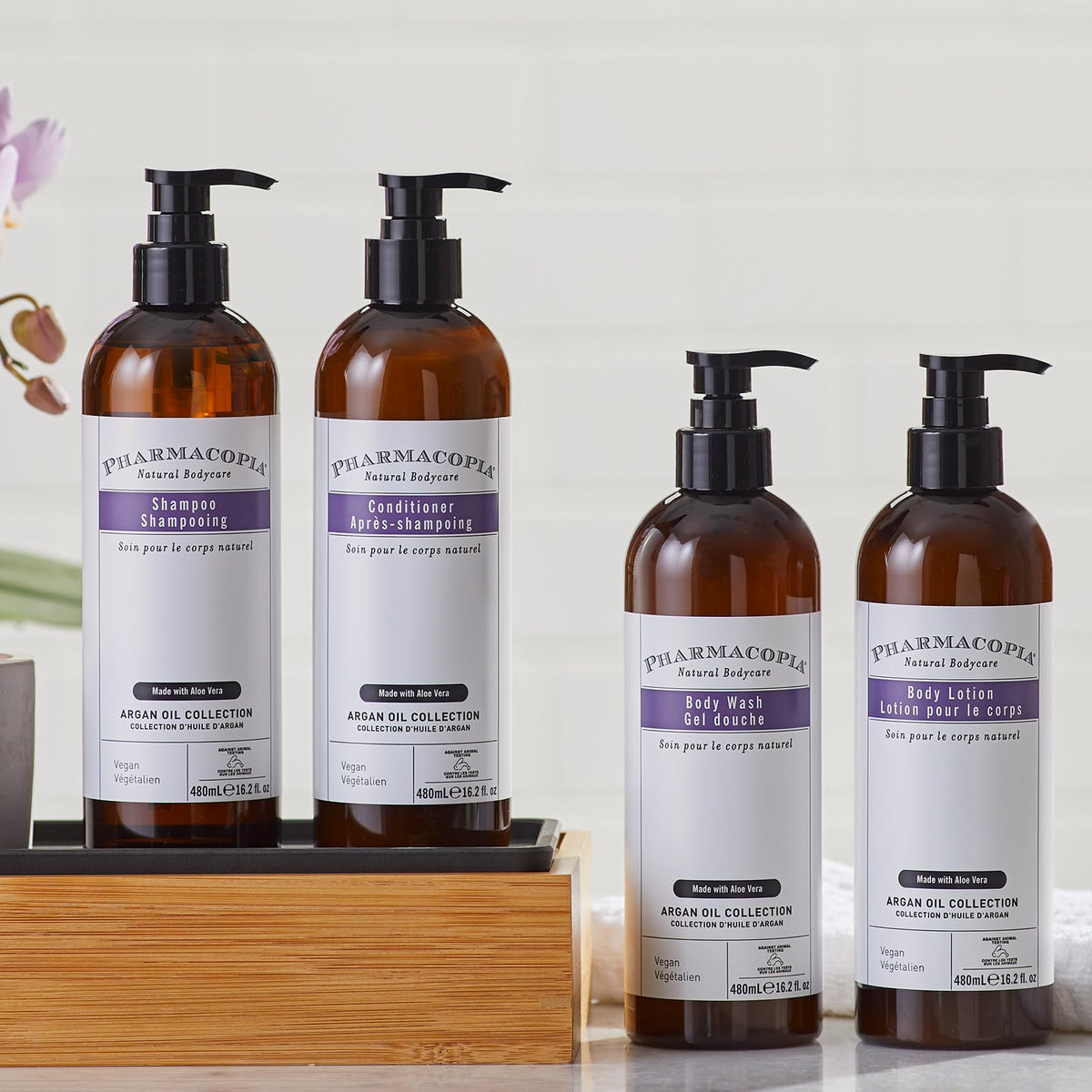 Pharmacopia conditioner among shower amenities illustrating travel-friendly use