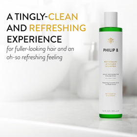 PHILIP B shampoo texture pouring to show lightweight lather and cleansing benefit