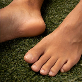 Phoenix Foot Peel beside shoes and socks showing scale and suitability for men