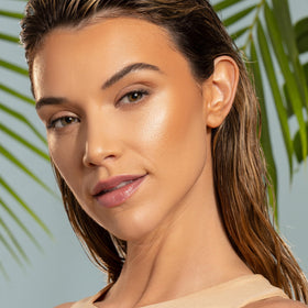 Physicians Formula application on cheek highlighting natural lift and glow