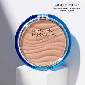Physicians Formula compact held in hand showing size for travel-friendly benefit