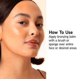Physicians Formula brush blending bronzer on cheek for seamless, buildable contouring