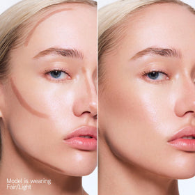 Physicians Formula contour stick held in hand to show size and travel-friendly convenience