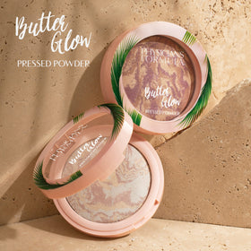 Physicians Formula powder next to skin swatches showing subtle luminous effect